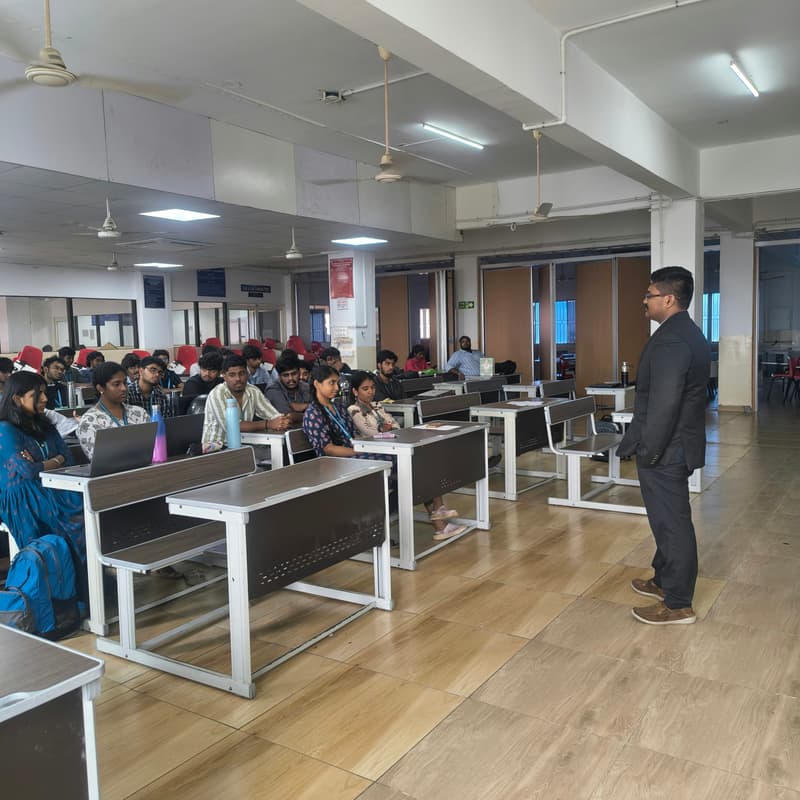 ForenX trainer briefing digital forensics interns in a college lab hall